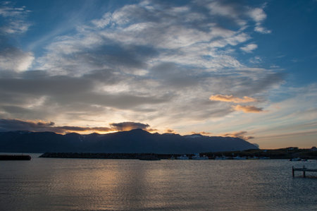 sunset over icelandic mountains on Trollaskagi peninsulaの写真素材