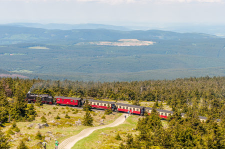 Brocken Germany - May 27. 2017: Steam train climping the tracks towards the top of Brocken Mountain