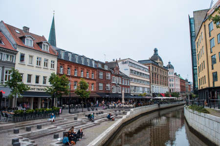 Aarhus Denmark - August 24. 2011: People having a good day at the banks of Aarhus canal on a summer dayのeditorial素材