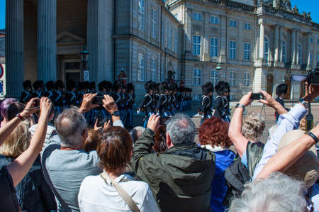 Copenhagen Denmark - May 17. 2014: The Royal Life Guards march by Amalienborg palace for the shift changeのeditorial素材