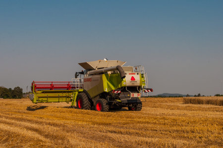 Vordingborg Denmark - August 14. 2015: Claas harvester on a grain fieldのeditorial素材