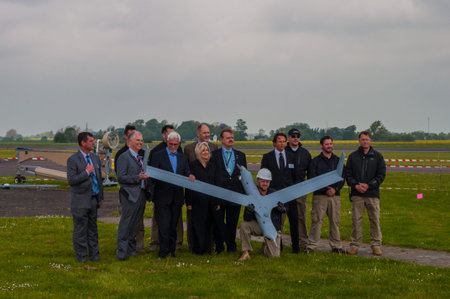 Odense Denmark - May 28. 2015: Delegation from Boeing posing with new spy drone being tested
