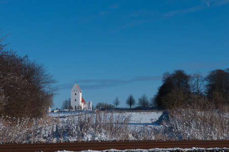 Kastrup Church in Denmark in winter landscapeの写真素材