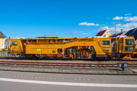 Nykoebing Denmark - April 22. 2016: Yellow railway construction machineのeditorial素材