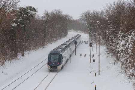 Vordingborg Denmark - February 3. 2018: A DSB IC4 train set leaving Vordingborg train station in Denmarkのeditorial素材