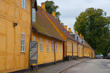Old yellow houses along a street in town of Soro in Denmarkのeditorial素材