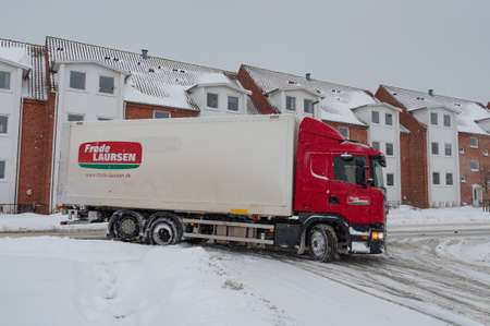 Vordingborg Denmark - March 1. 2018: Lorry driving on a snowy dayのeditorial素材