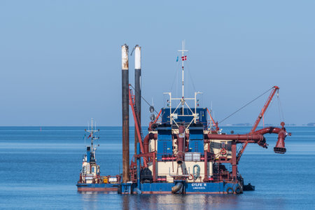 Vordingborg Denmark - March 30. 2018: Dredging in and around port of Vordingborg in Denmark