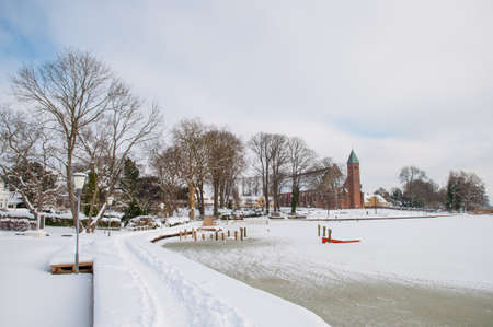 beautiful winter day by the lake in town of Maribo in Denmarkの写真素材