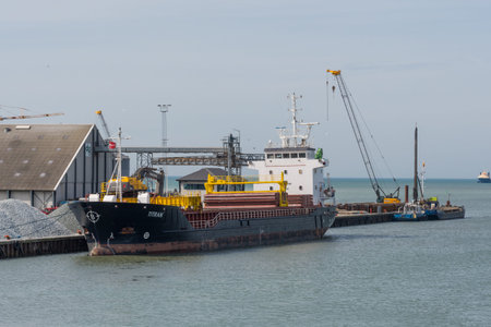 Vordingborg Denmark - April 7. 2018: cargo vessel Titran Delivering gravel in port of Vordingborgのeditorial素材