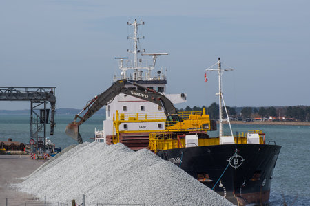 Vordingborg Denmark - April 7. 2018: cargo vessel Titran Delivering gravel in port of Vordingborgのeditorial素材