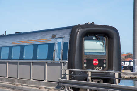 Vordingborg Denmark - April 6. 2018: A DSB IC3 train passing the Masnedsund bridge in Denmarkのeditorial素材