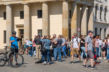 Berlin Germany - April 20. 2018: Tourists in front of the Brandenburger Tor on Pariser Platz square