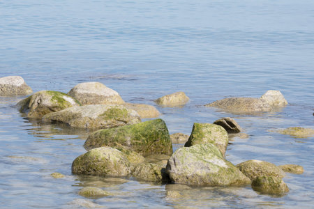 stones in the water at Moens klint chalk cliffs in Denmark