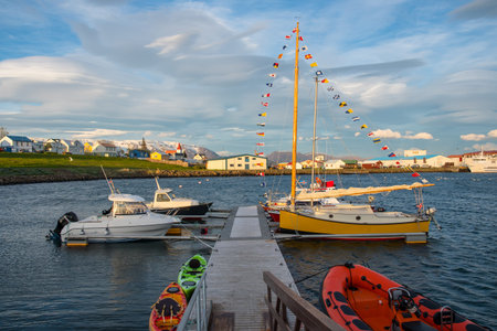 Boats in port of Hrisey in Iceland on a summer eveningの写真素材