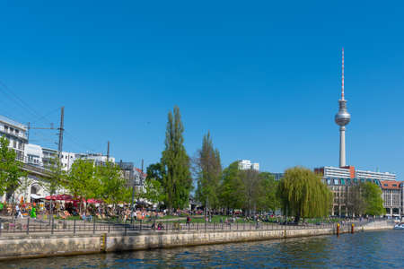 Berlin Germany - April 20. 2018: People enjoying a sunny day on the banks of river Spree in Berlinのeditorial素材