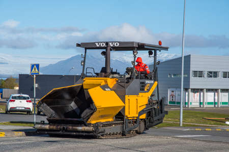 Hofn Iceland - May 25. 2018: Asphalt laying machin driving on the roadのeditorial素材
