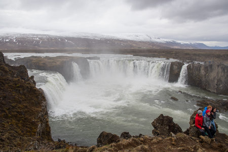 Godafoss Iceland - May 21. 2018: Tourists posing in front of Godafoss waterfall in North Icelandのeditorial素材