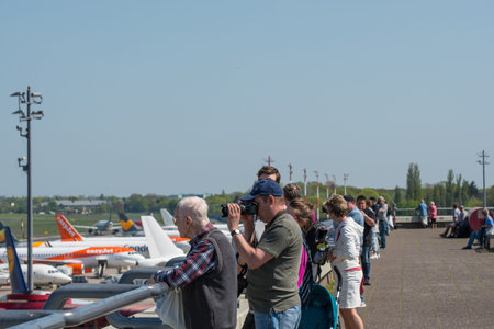 Berlin Germany - April 21. 2018: Berlin Germany - April 21. 2018: Airplane spotters looking at...