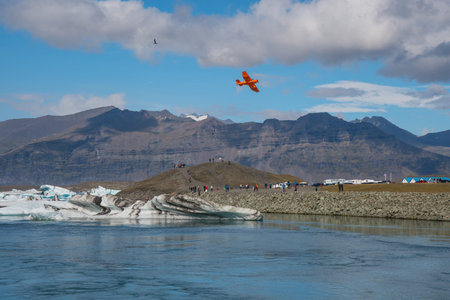 Jokulsarlon Iceland - August 18. 2018: Airplane flying over Jokulsarlon Glacier lagoon