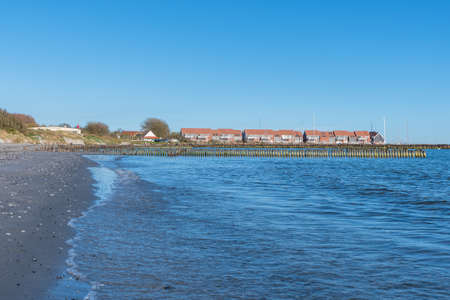 Coast and vacation apartments in town of Klintholm on island of Moen in Denmarkの写真素材