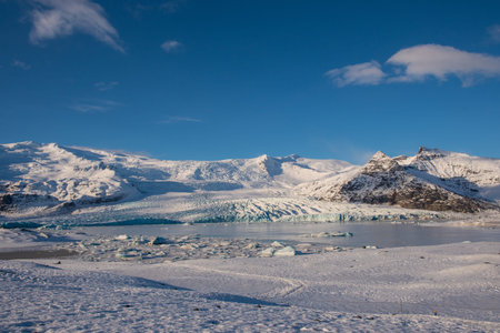 Fjallsarlon Iceberg lagoon with Vatnajokull glacier in south Iceland