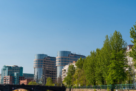 Berlin Germany - April 20. 2018: Modern buildings near Spree river with lot of trees on the...
