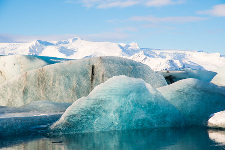 Icebergs in Jokulsarlon Glacier Lagoon in south Iceland with Vatnajokull glacier in the background