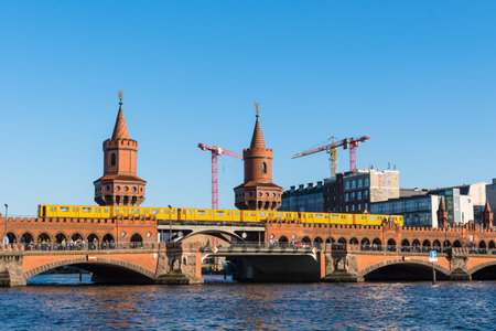Berlin Germany - April 21. 2018: U-Bahn train crossing the Oberbaum Bridge in city of Berlin in...