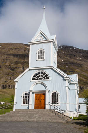 The church in town of seydisfjordur in Iceland on a sunny morningの写真素材