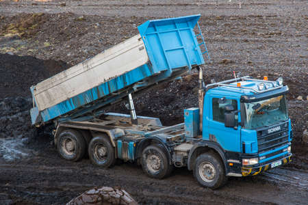 Hornafjordur Iceland - February 27. 2019: Scania truck unloading mud at the tipのeditorial素材
