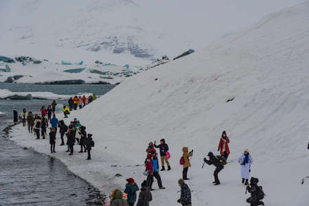 Jokulsarlon Iceland - February 5. 2019: Tourists having a fun day at the jokulsarlon glacier lagoon tourist destinationのeditorial素材