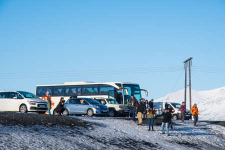 Jokulsarlon Iceland - February 17. 2019: Tourists leaving a bus at the diamond beachのeditorial素材