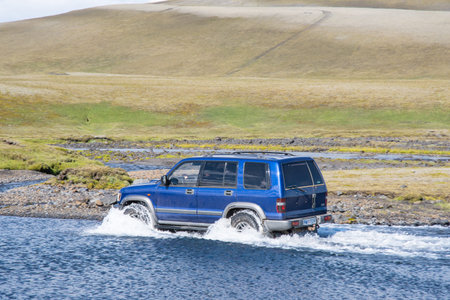 Eldgja Iceland - July 6. 2020: 4x4 car crossing an Icelandic rural countryside river