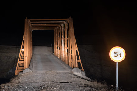 Old bridge crossing Heinabergsvotn river which os not longer running under the bridge on the...