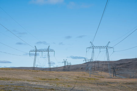 Power lines in the Icelandic highlands countryside landscape on a sunny summer dayの写真素材
