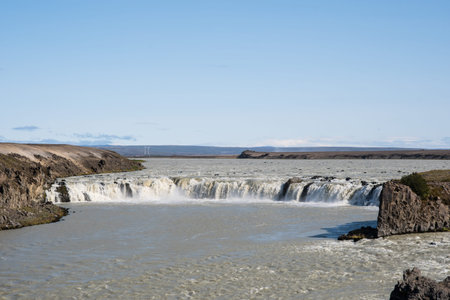 Waterfall Trollkonuhlaup in river thjorsa in Iceland on a sunny summer day