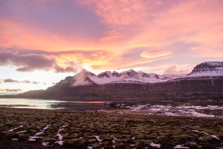 The sunset in Berufjordur fjord in east icelandic countryside landscapeの写真素材