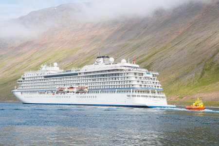 Isafjordur Iceland - July 5. 2021: Cruise ship Viking Sky leaving port of Isafjordurのeditorial素材