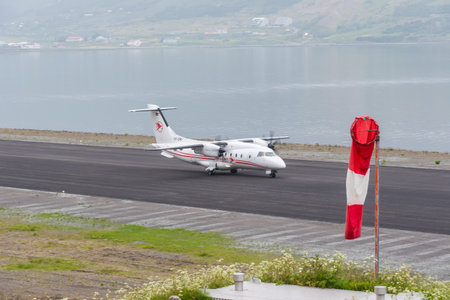 Isafjordur, Iceland - July 6. 2021: eagle air Dornier 328 turboprop airplane on the runway of...