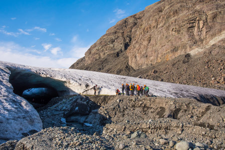 Jokulsarlon Iceland - March 6. 2021: Tourists on the way towards an Ice cave in Breidamerkurjokull glacierのeditorial素材