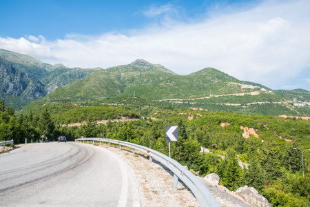 Road in the mountains of the Albanian Riviera on a sunny summer dayの写真素材