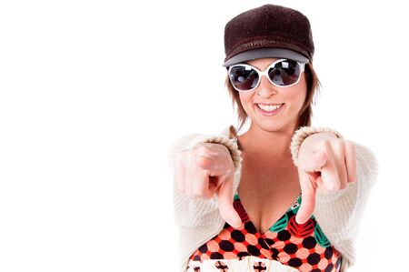 Cute Trendy woman pointing at camera on a isolated white backgroundの写真素材