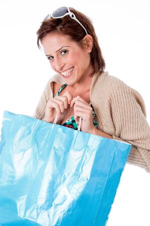 portrait of pretty young women smiling with shopping bag on white isolated backgroundの写真素材