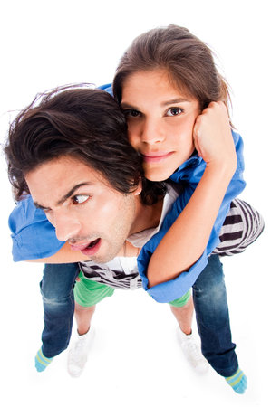 Happy young man piggy back his girlfriend,full lenthの写真素材
