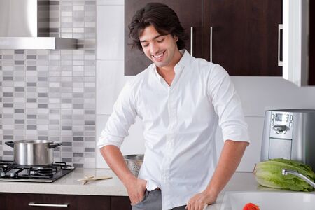 Portrait of happy man in the kitchenの写真素材