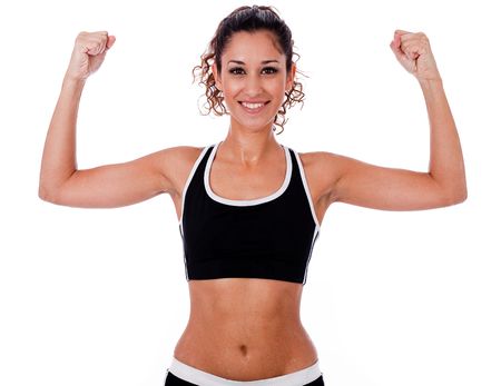 Woman raising her hands doing exercises,indoor studioの写真素材