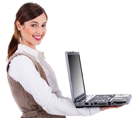 Fashion model holding a open laptop on a white isolated backgroundの写真素材
