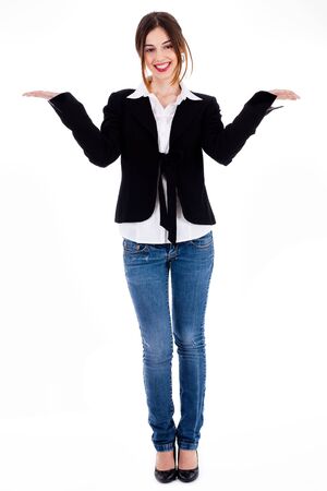Full length of women posing with her hands open up on a white backgroundの写真素材