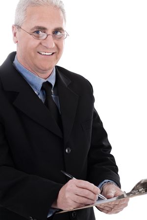 Portrait of smiling business man writing at pad on white backgroundの写真素材